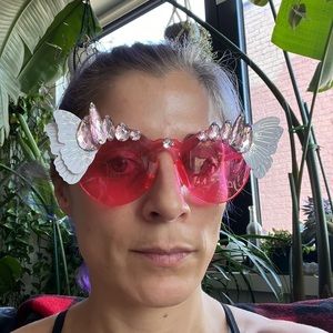 Pink sunglasses with holographic butterfly wings